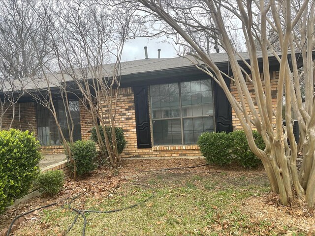 single story home with a front lawn and a garage