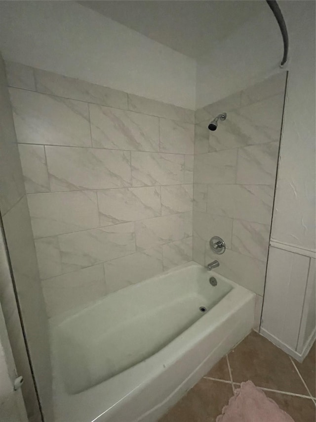 bathroom featuring tile patterned flooring and tiled shower / bath combo