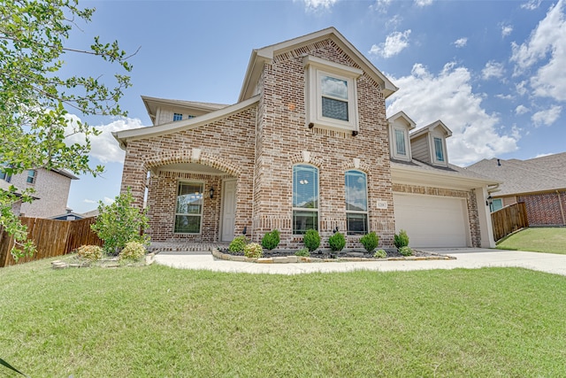 view of front of property with a front lawn and a garage