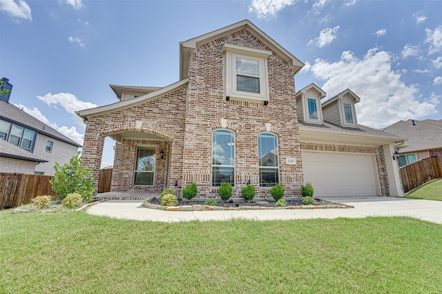 view of front facade with a front yard and a garage