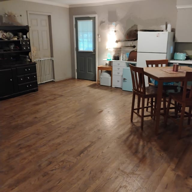 308 County Road 1296, Morgan, TX 76671 - dining area featuring ornamental molding and wood finished floors