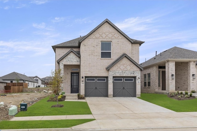 french country style house featuring a garage and a front yard