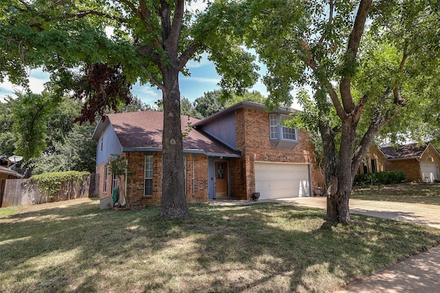 view of front of property with a garage and a front yard