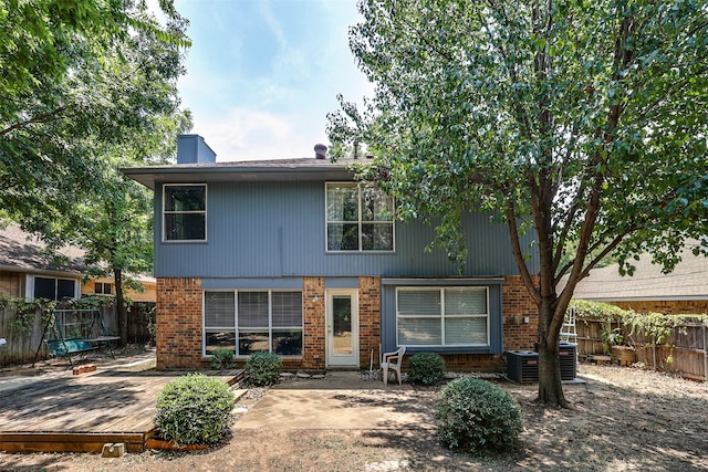 view of front of property with a deck and a patio