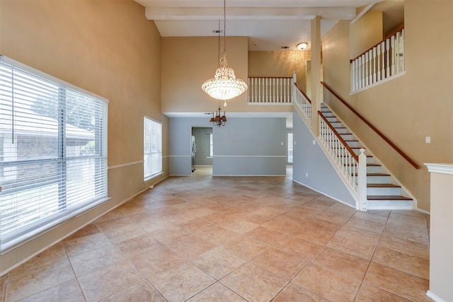 tiled entryway with high vaulted ceiling, a chandelier, and beamed ceiling