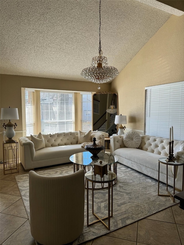 tiled living room featuring vaulted ceiling and a textured ceiling