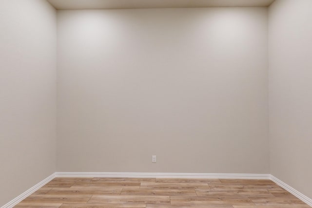 unfurnished room with light wood-type flooring