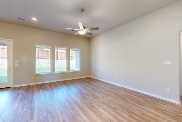 unfurnished room featuring light hardwood / wood-style flooring and ceiling fan