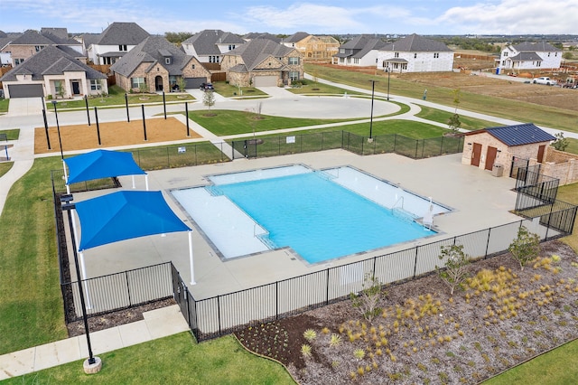 view of swimming pool with a yard and a patio