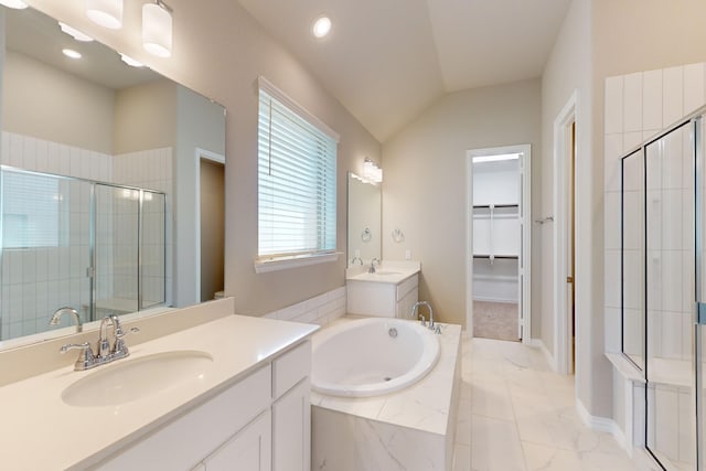 bathroom with vanity, separate shower and tub, and lofted ceiling