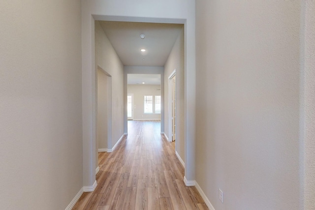 corridor featuring light hardwood / wood-style floors