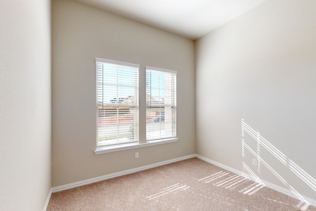 unfurnished room with carpet flooring