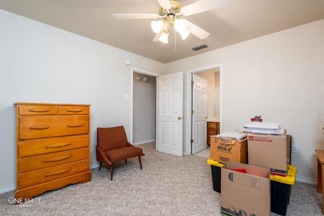 rec room with light carpet and ceiling fan