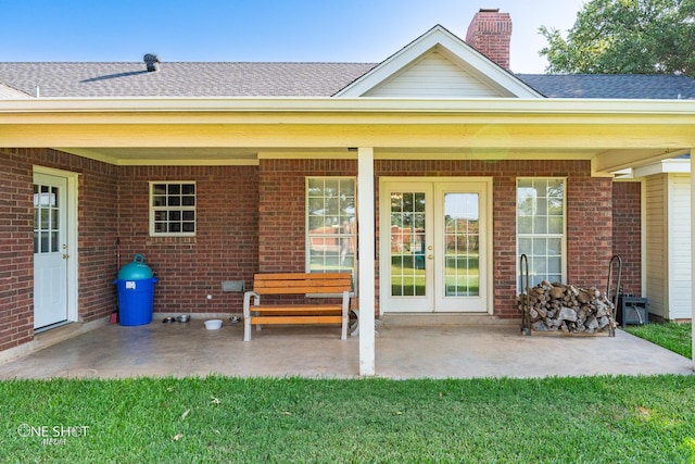 rear view of house with a patio area and a yard