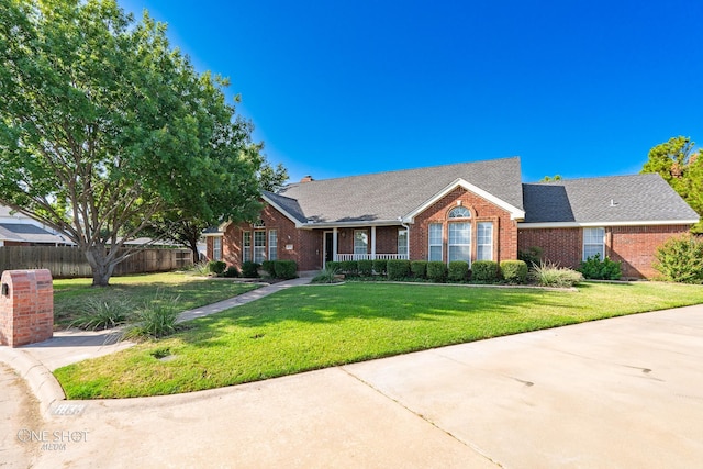 single story home featuring a front yard