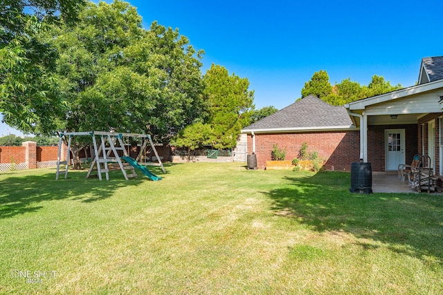 view of yard with cooling unit and a playground