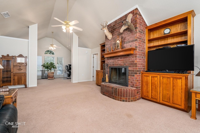 living room with ceiling fan, light colored carpet, a brick fireplace, brick wall, and high vaulted ceiling