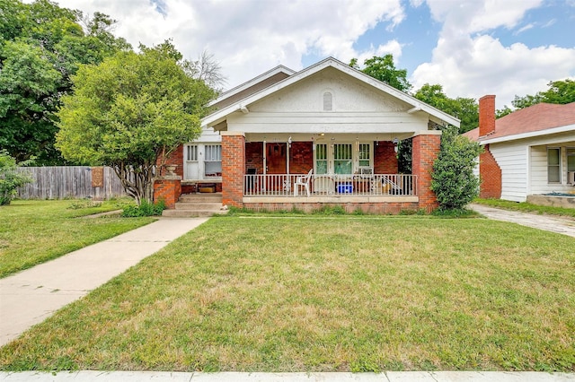 bungalow-style house featuring a front yard and a porch