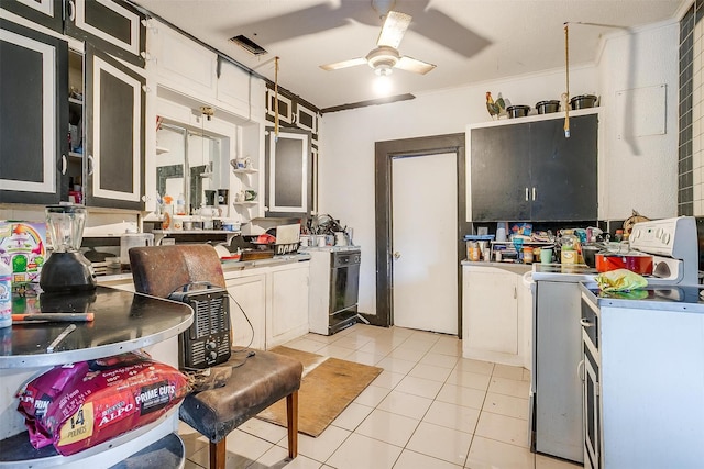 kitchen with white cabinets, white range with electric stovetop, ornamental molding, ceiling fan, and light tile patterned floors