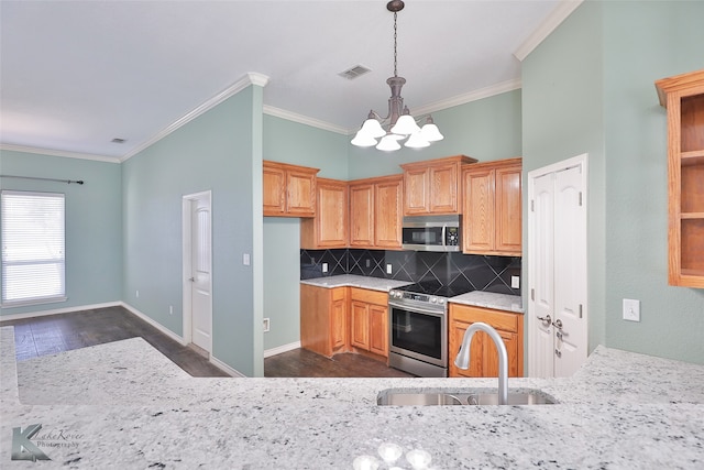 kitchen featuring sink, dark hardwood / wood-style flooring, decorative backsplash, and stainless steel appliances