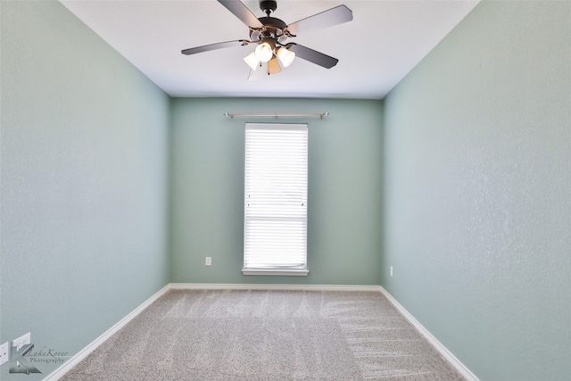 carpeted empty room with ceiling fan