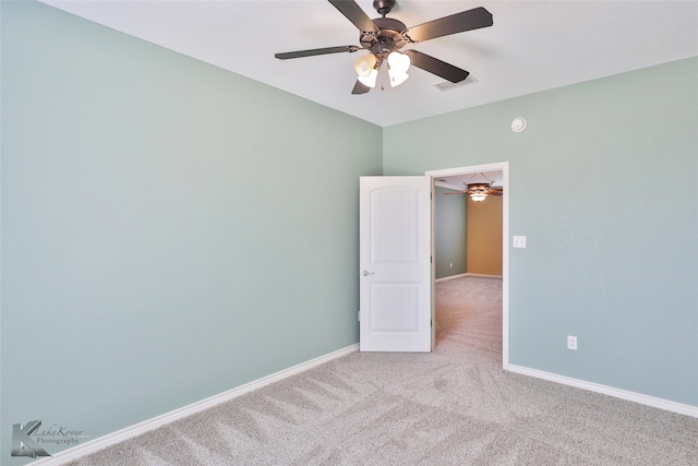 empty room with carpet floors and ceiling fan