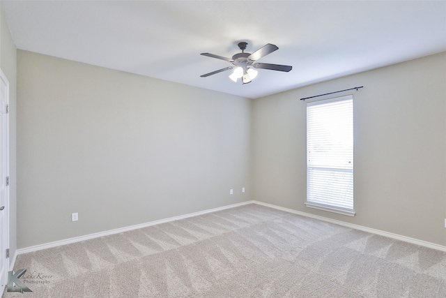 unfurnished room featuring carpet, ceiling fan, and a healthy amount of sunlight