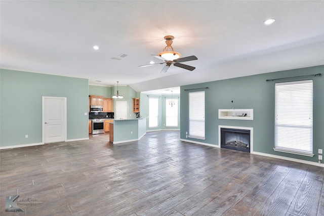 unfurnished living room featuring ceiling fan and hardwood / wood-style floors