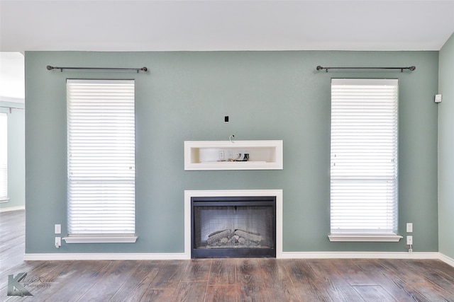 unfurnished living room featuring hardwood / wood-style floors