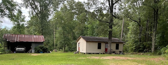 view of outbuilding featuring a yard