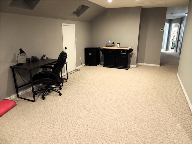 home office featuring carpet and vaulted ceiling