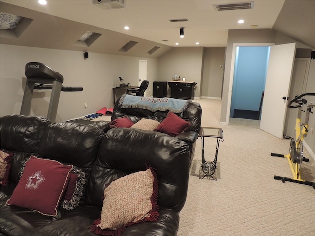 carpeted cinema room with lofted ceiling