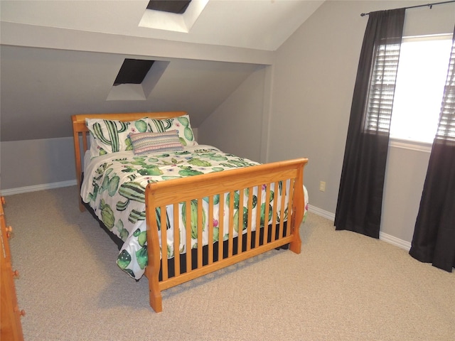 bedroom featuring light colored carpet and lofted ceiling