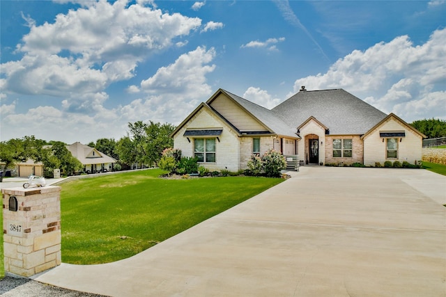 view of front of home with a front lawn