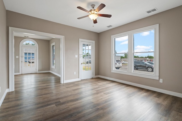 empty room with ceiling fan and wood-type flooring