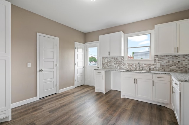 kitchen featuring sink, dark hardwood / wood-style floors, and white cabinetry