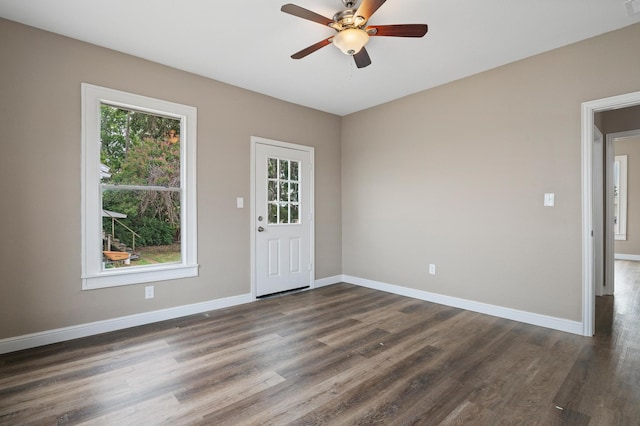 entrance foyer with ceiling fan, dark hardwood / wood-style flooring, and plenty of natural light