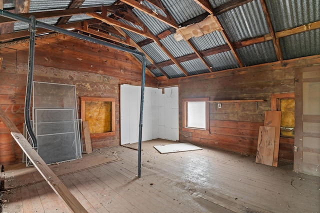 interior space featuring hardwood / wood-style flooring and lofted ceiling