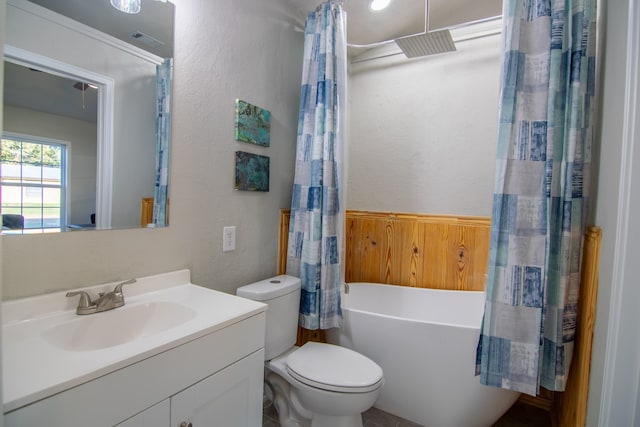 full bathroom with shower / tub combo, vanity, and toilet