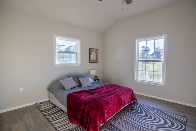 bedroom featuring lofted ceiling, ceiling fan, and dark hardwood / wood-style floors