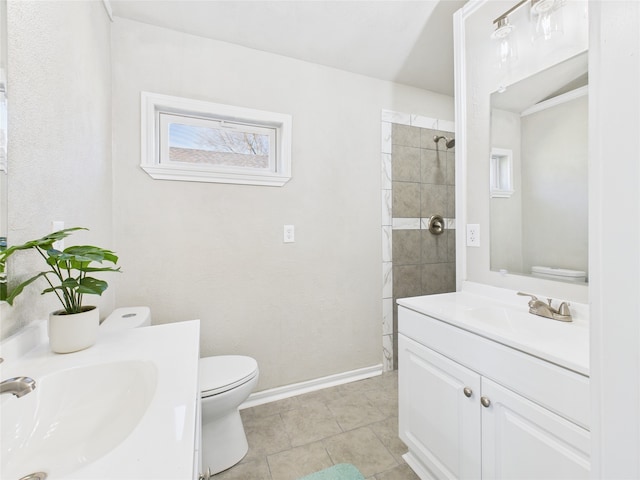 full bathroom with tile patterned floors, toilet, vanity, and baseboards