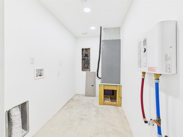 washroom featuring washer hookup, laundry area, recessed lighting, and tankless water heater