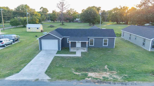 ranch-style home featuring an outbuilding and a front lawn