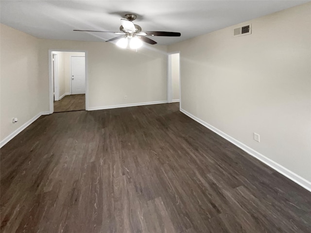 unfurnished room with dark hardwood / wood-style floors and ceiling fan