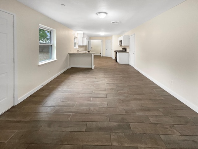 hallway featuring dark hardwood / wood-style flooring and sink