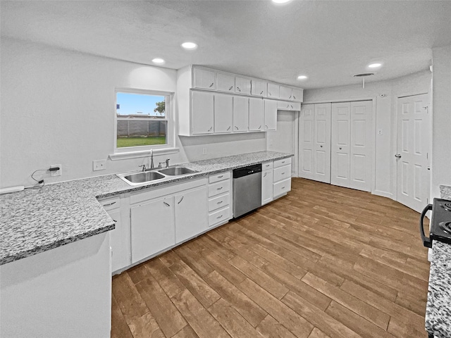 845 Dianna Ave, Hurst, TX 76053 - kitchen with black appliances, a sink, ceiling fan, dark stone countertops, and white cabinetry