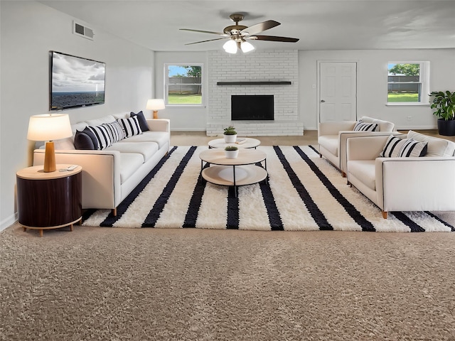 845 Dianna Ave, Hurst, TX 76053 - living area featuring a ceiling fan, baseboards, and a brick fireplace