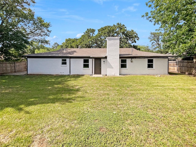845 Dianna Ave, Hurst, TX 76053 - rear view of property featuring a chimney, brick siding, and roof with shingles