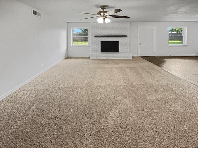 845 Dianna Ave, Hurst, TX 76053 - empty room featuring healthy amount of natural light, a ceiling fan, baseboards, and wood finished floors