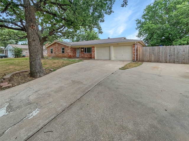 ranch-style house featuring a garage